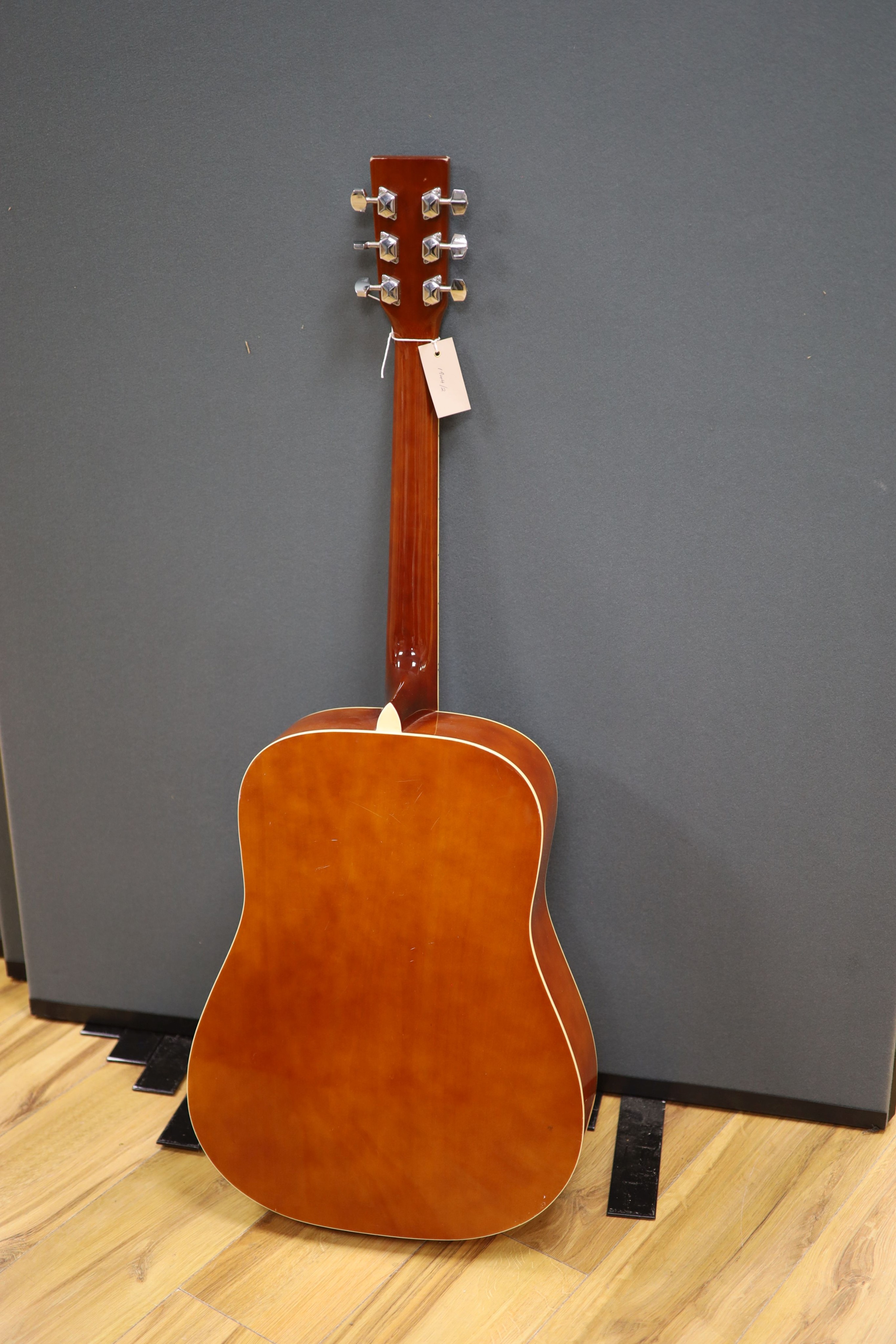 A Chantry Sunburst acoustic guitar